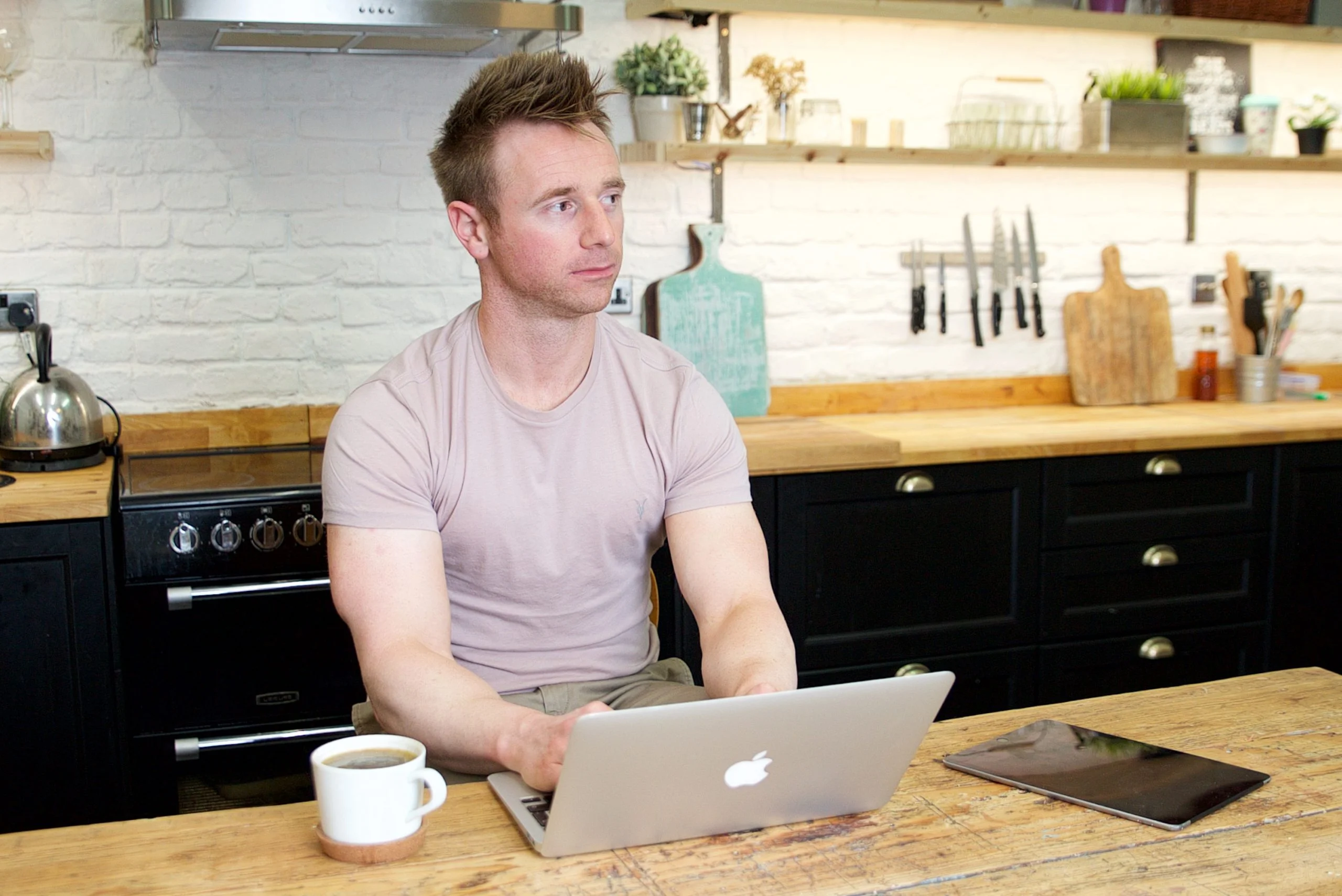 Fitness coach Scott Laidler working on laptop computer