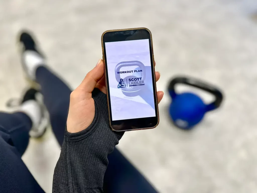 Scott Laidler online fitness program on phone showing fitness app