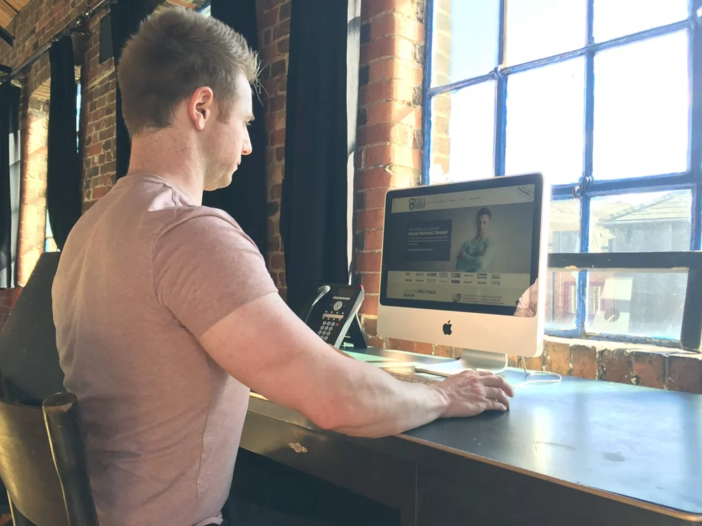 online personal trainer Scott Laidler working at his desk
