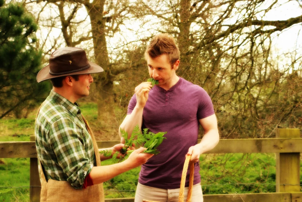 Fitness expert Scott Laidler foraging for wild Garlic with chef Carl Shillingford in Suffolk, UK.