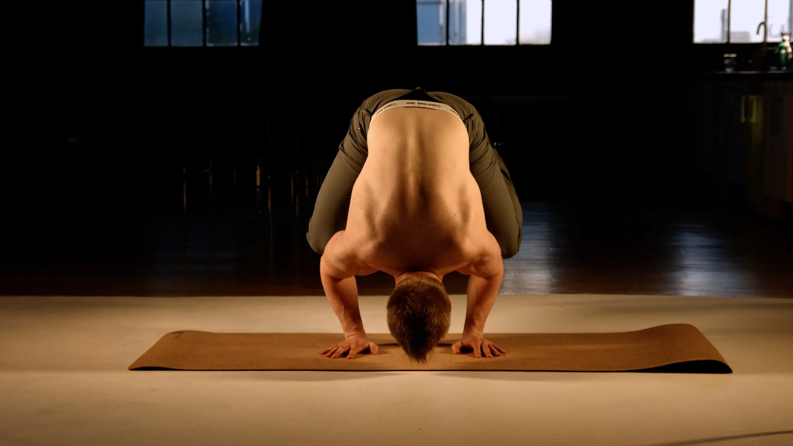 fitness coach scott laidler in yoga crane pose