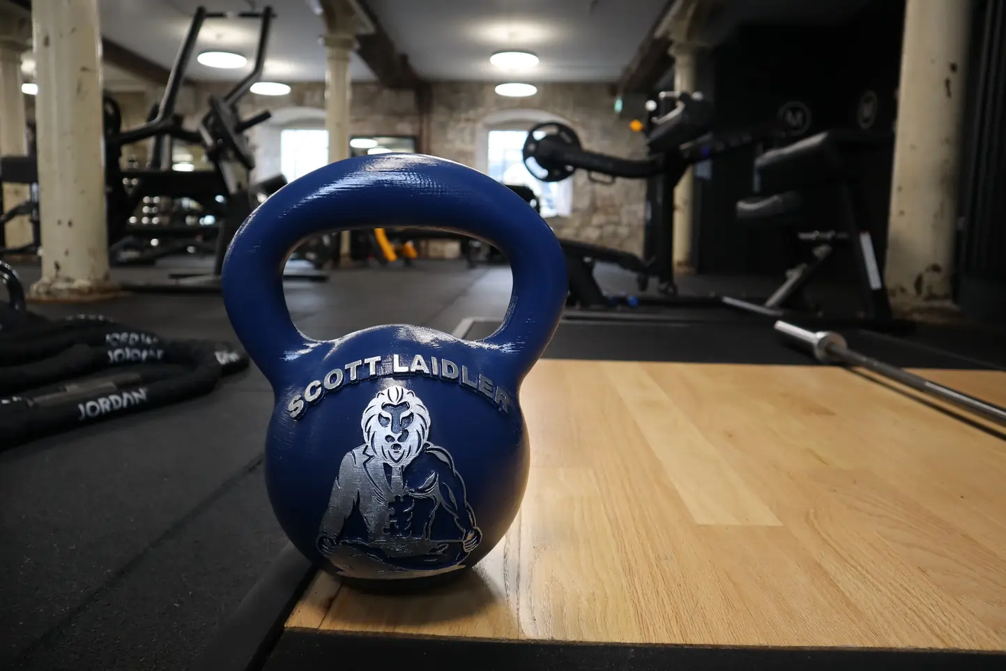 Scott Laidler branded kettlebell on the floor of his home personal training facility